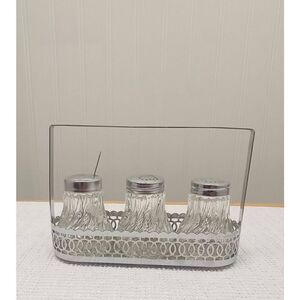 Vintage Crystal like l salt and pepper in silver plated caddy